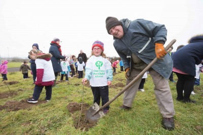 **NO REPRO FEE** Ella Meehan gets a little help with her tree from Mort Collins at the "One Tree per Child" initiative at Active Kilrush Sports Project. Kilrush Tidy Towns, in partnership with local schools and Clare County Council, have embarked on an initiative to ensure every child will plant a tree of their own As part of National Tree Week. Photograph by Eamon Ward