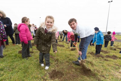 **NO REPRO FEE** Marissa Ward gets a little help with her tree from Paul Edson, Chairman Kilrush Tidy Towns and friends from local primary schools St. Senan’s NS and Gaelsoil Ui Choimin planting their trees as part of the "One Tree per Child" initiative at Active Kilrush Sports Project. Kilrush Tidy Towns, in partnership with local schools and Clare County Council, have embarked on an initiative to ensure every child will plant a tree of their own As part of National Tree Week. Photograph by Eamon Ward